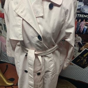 Light pink trenchcoat with black buttons